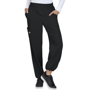 Black pants with pockets, featuring an elasticised waistband and cuffed hems, worn with a white long-sleeve top and black shoes.