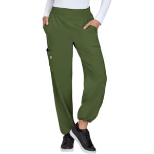 Olive green pants with an elastic waistband and pockets, styled in a relaxed fit. Footwear includes black sneakers.