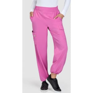 Bright pink pants with a relaxed fit, featuring side pockets and an elastic waistband. A logo is visible on the garment.