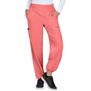 Coral cargo pants featuring pockets and an elastic waistband, worn with a white top and black sneakers.
