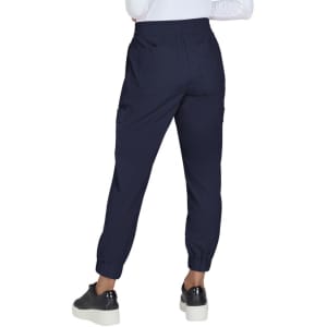 A pair of navy jogger pants with an elastic waistband and cuffed ankles, featuring side pockets.