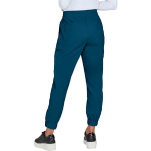 A pair of teal joggers with elastic cuffs and a waistband, featuring side pockets and a smooth finish.