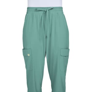 A pair of teal jogger pants with an elastic waistband and side pockets, featuring a small logo.