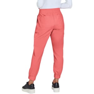 A pair of coral joggers featuring an elasticated waistband and cuffs, shown from the back view.