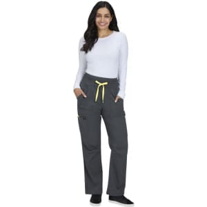 A pair of grey wide-leg pants with a yellow drawstring and pockets, worn by a smiling model in a white top.