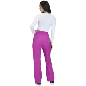 A person wearing wide leg pants in bright pink, viewed from the back, with a white long-sleeve top.