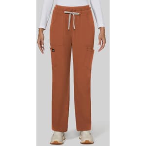 A pair of wide-leg pants in burnt orange, featuring pockets and a drawstring waist. The model is wearing a white long-sleeve top.