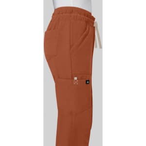 Freda Wide Leg Pant in earthy orange with an elastic waistband and side pockets displayed against a grey background.