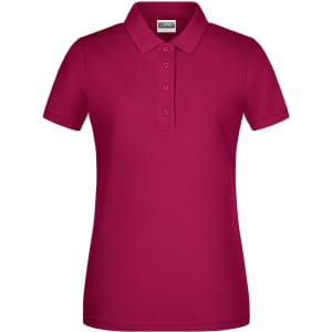 A ladies polo shirt in a vibrant magenta colour with a classic collar and three-button placket. It features a logo.