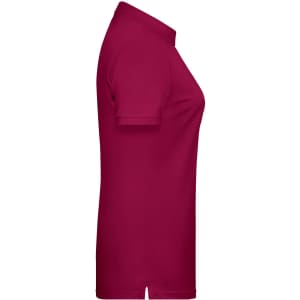 A women's polo shirt in a vibrant burgundy colour, featuring a classic collar and a side split.