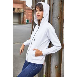 A white zip hoodie with a hood, featuring front pockets and a slight branding logo, worn by a model.