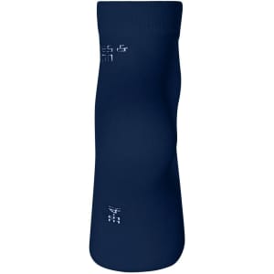 A pair of organic sneaker socks in dark navy, featuring a logo on the side.