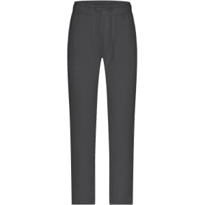A pair of grey lounge pants with a drawstring waist and a slim fit design. Features a logo on the waistband.