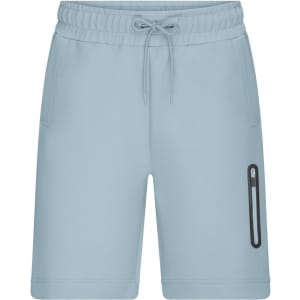 Light blue sports shorts featuring an elastic waistband and a zippered pocket on the side. There is a branding logo included.