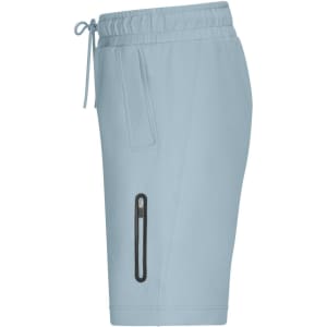 Light blue sports shorts featuring an elastic waistband and side zip pocket. Includes branding on the fabric.