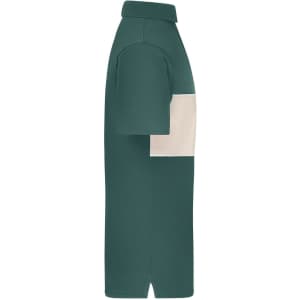 A side view of a polo shirt featuring a dark green body and a cream colour-block section across the chest.