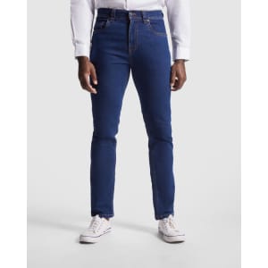 A pair of blue denim jeans with a slim fit and a light distressing at the hem, worn with white sneakers.