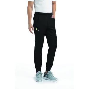 A pair of black joggers featuring a half elastic waistband and side pockets, worn with grey sneakers.