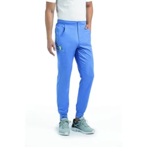 A blue jogger with a half elastic waistband, featuring side pockets and a logo.