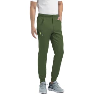 Green jogger pants with a half elastic waistband, side pockets, and a fitted cuff. Features a logo on the waistband.