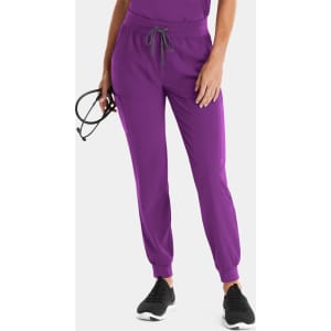 A pair of women's joggers in vibrant purple with an elastic waistband and drawstring. Features pockets and a logo.