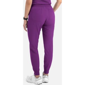 A pair of women's joggers in purple, featuring an elastic waistband and ankle cuffs, with back pockets.