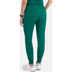 Women's jogger pants in a vibrant green colour, featuring a fitted waist and ankle cuffs. Includes branding on the garment.