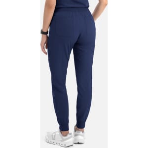 Navy women's jogger pants with a fitted waist and ankle cuffs, featuring back pockets and a sleek design.