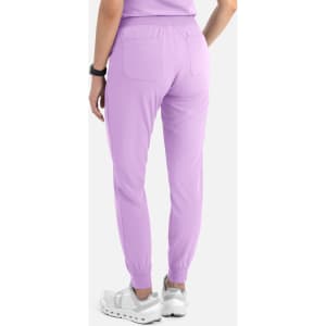 A pair of women's joggers in light purple, featuring a fitted cuff at the ankles and pockets at the back.