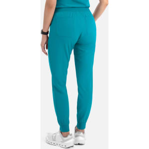 A pair of women's joggers in teal, featuring a fitted waistband and elastic cuffs, with two back pockets.