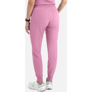 A pair of women's joggers in a soft pink colour, featuring a tapered leg and elastic cuffs.