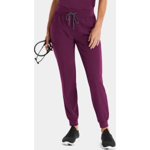 A pair of women's joggers in a rich plum colour with a drawstring waistband and fitted cuffs.