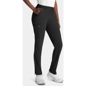 A pair of black skinny pull-on pants with a drawstring waist and side pocket. Features a logo on the fabric.