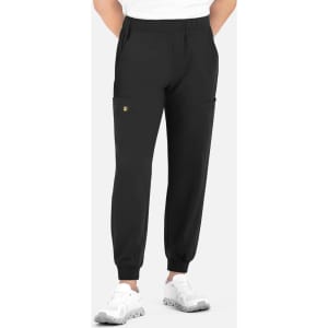 A pair of black jogger pants with a full elastic waistband and side pockets, modelled by a person wearing a white shirt.