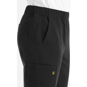 A pair of black jogger pants featuring a full elastic waistband and side pockets, with a small logo.