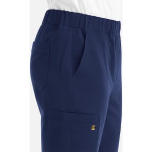A navy jogger featuring a full elastic waistband, side pockets, and a logo detail.