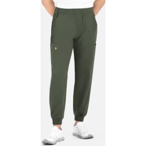 Olive green joggers featuring a full elastic waistband and side pockets, worn with a white t-shirt and shoes.