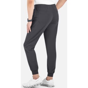 A pair of dark grey joggers with a full elastic waistband, featuring pockets and fitted cuffs at the ankles.