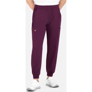 A pair of men's joggers featuring a full elastic waistband in purple with side pockets and a logo.