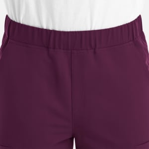 A close-up of a men's jogger featuring a full elastic waistband in a deep purple colour.