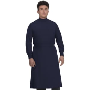 A man wearing a navy blue clinical cover gown with long sleeves and a high collar.