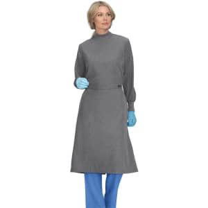 A clinical cover gown in grey, worn by a model with blue gloves and blue pants. The gown has long sleeves and a high collar.