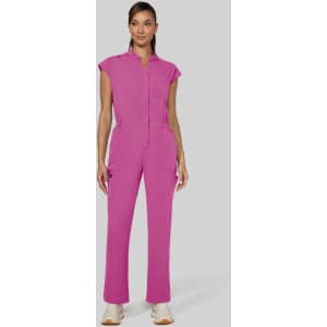 A jumpsuit in bright pink with a collared neckline and pockets, featuring a fitted silhouette and short sleeves.
