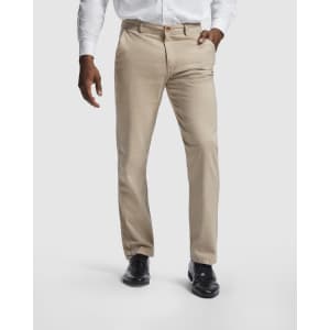 Beige trousers with a straight fit, featuring pockets and a logo, paired with a white shirt and black shoes.