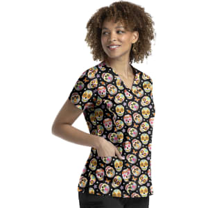 A women's V-neck top with a vibrant skull print on a black background, featuring short sleeves and a pocket.