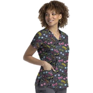 A women's v-neck top in black featuring a colourful print of various sunglasses and stars, with a logo.