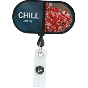 A shaker badge with a black and white design, featuring red and white crystals within a clear compartment and a logo.