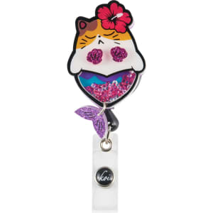 A pink and white shaker badge featuring a cat mermaid design with a flower and glitter elements, and a logo.