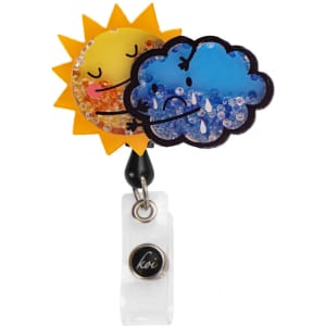 A vibrant sun and cloud shaker badge with glittery details, featuring yellow, blue, and clear elements, on a clear backing.