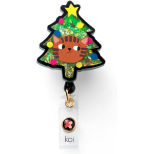 A festive badge featuring a green glittery Christmas tree design with a cat face and colourful decorations, complete with a logo.